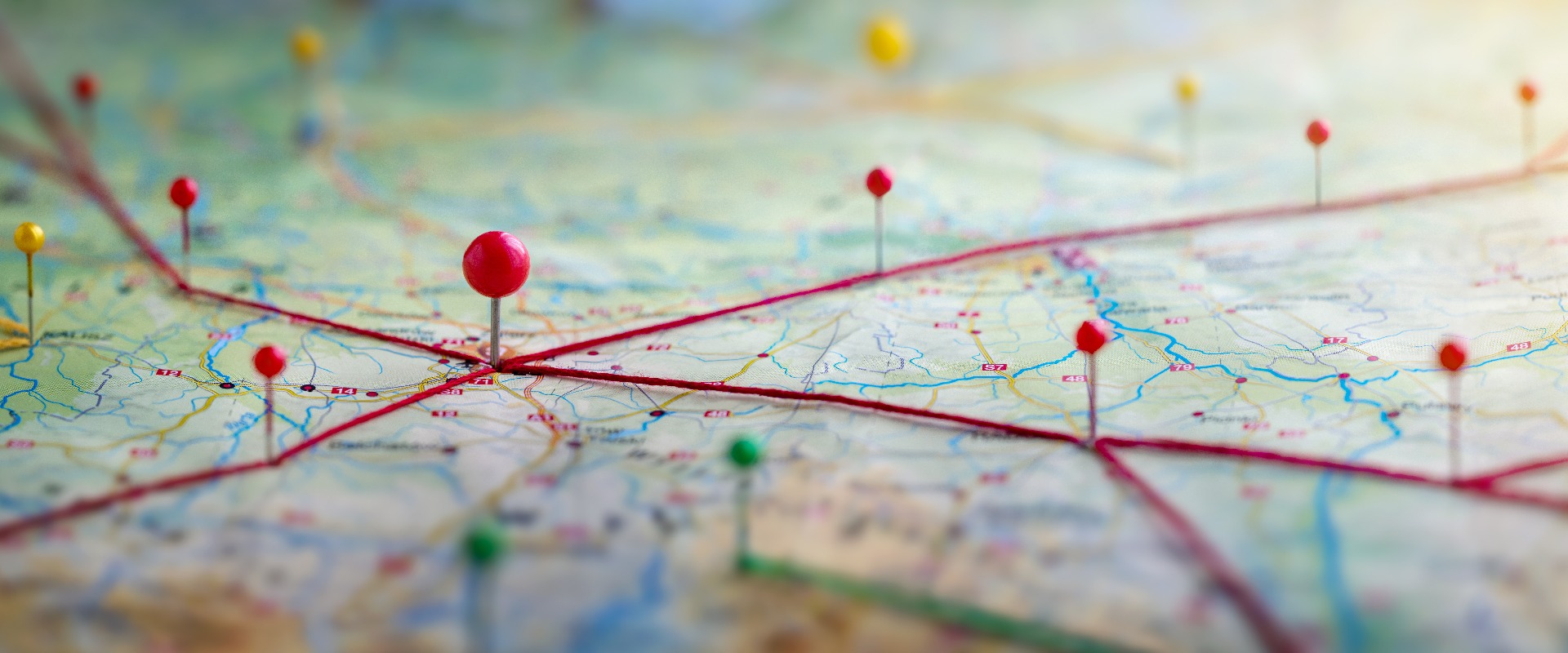 Find your way. Location marking with a pin on a map with routes. Adventure, discovery, navigation, communication, logistics, geography, transport and travel theme concept background.