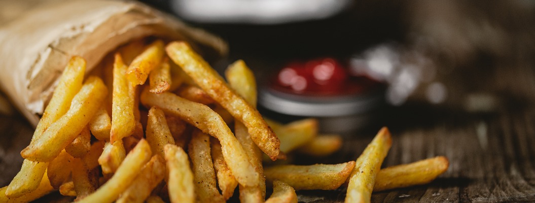 French fries in a basket with ketchup